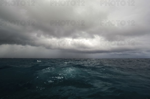 Tropical storm Growing typhoon due to climate change Storm with dark clouds over agitated sea,