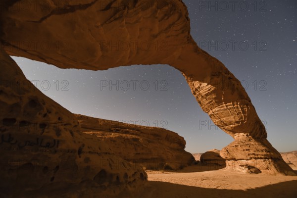 Starry sky above The Arch, also known as Rainbow Rock, near AlUla, Medina Province, Saudi Arabia,
