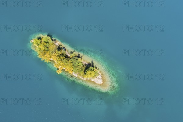Bird's eye view of the chive island in the turquoise waters of Lake Walen in the canton of St.