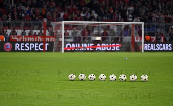 8 Adidas match balls with Champions League logo lie in front of goal, perimeter advertising RESPECT