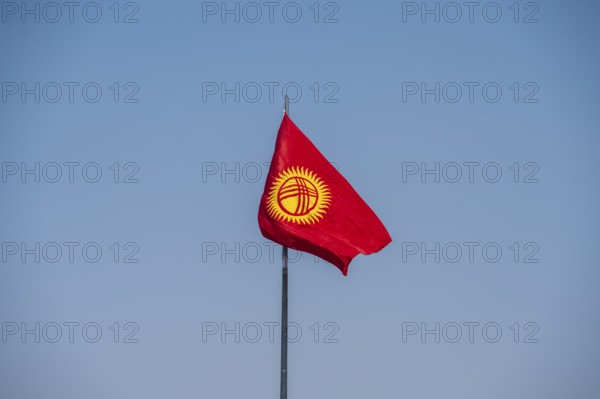 Kyrgyz flag in front of a blue sky, Bishkek, Kyrgyzstan, Asia