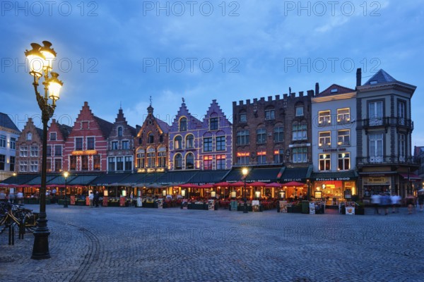 Bruges, Belgium, May 29, 2018: Bruges Grote markt square famous tourist place with many cafe and