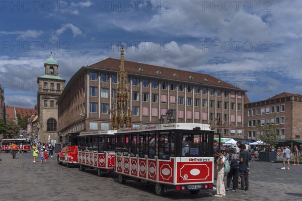 City Train tourist train at the Main Market Square, Old and New Town Halls and Schöner Brunnen,