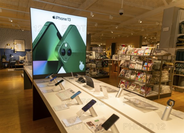 Apple iPhone 13 mobile phone display in John Lewis at Home shop, Ipswich, Suffolk, England, UK
