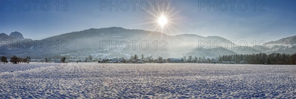 Wide wintry panorama with snow, sunny mountains and clear sky, Bad Feilnbach