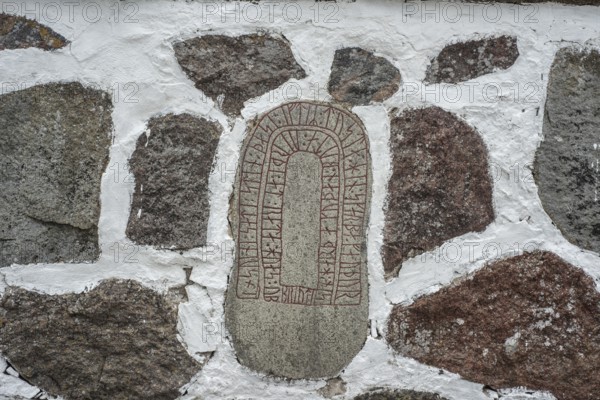 Rune stone embedded in a wall in Glemmingebro, Ystad Municipality, Skåne County, Sweden,