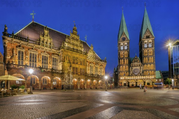 Market square, town hall square with town hall and cathedral in the historic city centre at dusk,