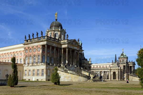 An imposing baroque palace on a sunny day with a blue sky and few clouds, The Communs, Sanssouci