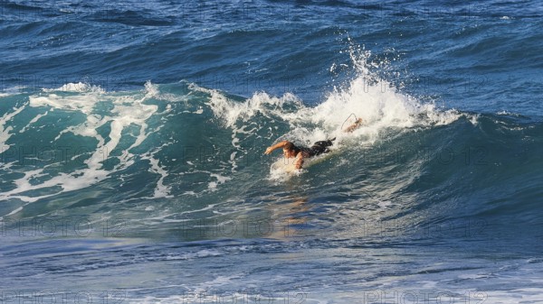 Surfer riding a big wave in the blue sea, wave surfer, surfer, surf, waves, west coast, Arkasa,