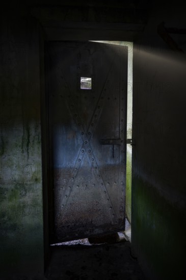 Bunker door from inside, Bunker Cheneux, dark, rays of light, 2nd World War, built 1933-1936,