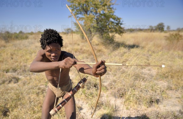 Bushman of the Ju/' Hoansi-San with bow and arrow while hunting, village //Xa/oba, near Tsumkwe,