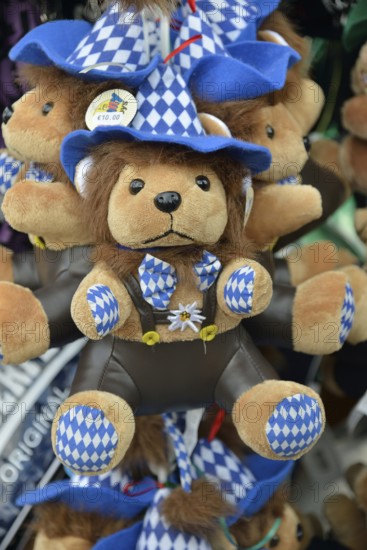 Teddy bear in traditional Bavarian dress on a stall, Oktoberfest, Munich, Upper Bavaria, Bavaria,