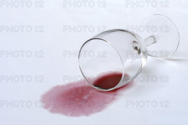 Red wine stain, overturned red wine glass on fabric, stain
