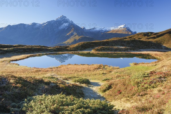 Piz Beverin and mountain lake, Grisons, Switzerland, Europe