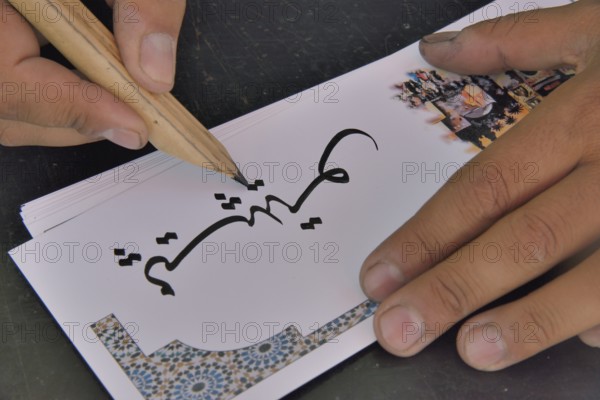 Calligrapher at work, Marrakesh, Marrakesh-Tensift-El Haouz region, Morocco, Africa