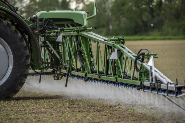 Agriculture, pesticide being sprayed on a field, sugar beet seedlings, North Rhine-Westphalia,