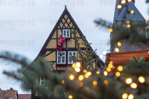 Historic half-timbered house with Father Christmas, Christmas lights, Quedlinburg, Saxony-Anhalt,