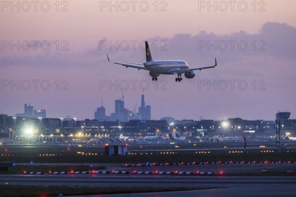 Aircraft of the airline Lufthansa approaching in the early morning, Frankfurt Airport, Fraport.