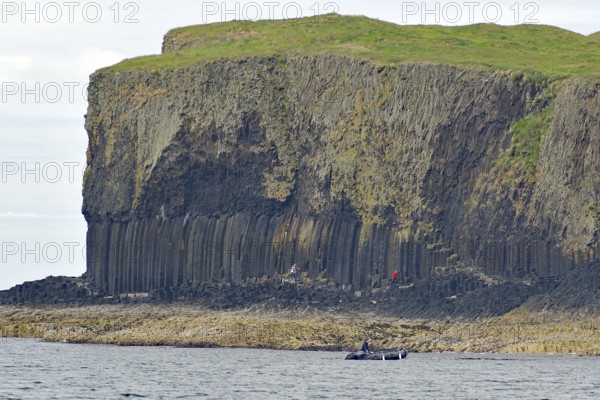 A coastline with prominent basalt cliffs and green grassland above, Hebridean Overture, Isle of