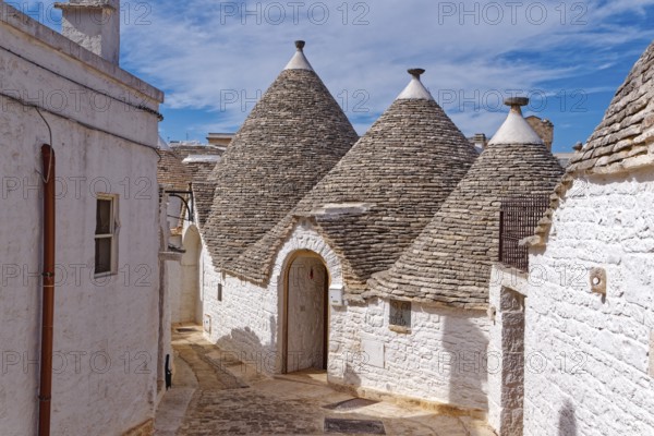 Whitewashed trulli, round houses with stone roofs, in the southern Italian town of Alberobello. The