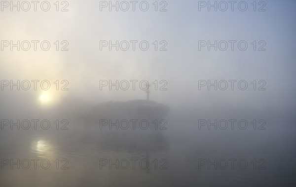 Cargo ship sailing in fog in the Kiel Canal, Kiel Canal, Schleswig-Holstein, Germany, Europe