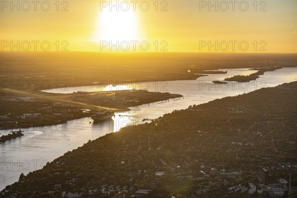 Aerial view of Hamburg harbour with Elbe, Airbus Airport Finkenwerder at sunset, Hamburg, Germany,