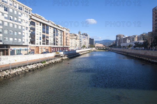 Straightened walled canalised channel of Rio Guadalmedina river, Malaga city centre, Spain, Europe