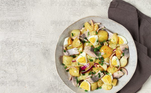 Potato salad with herring and eggs, Scandinavian cuisine, homemade, no people