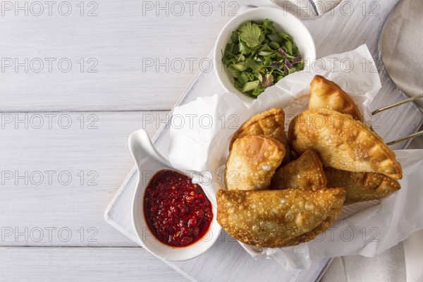 Fried chebureks, close-up, on a white background, no people