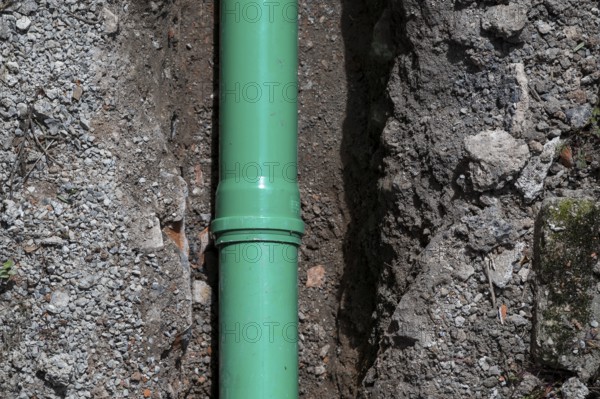 Newly laid green sewage pipe in a trench, Stuttgart, Baden-Württemberg