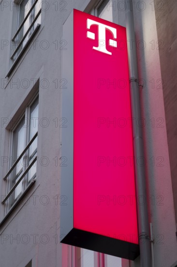 Telekom, facade with sign and logo, illuminated, Essen, Ruhr area, North Rhine-Westphalia, Germany,