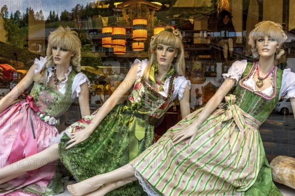 Shop window of fashion shop for traditional costumes, female mannequins, woman in dirndl, Wallgau,