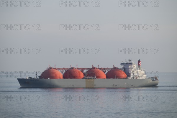 Liquefied natural gas is transported by LNG tanker Arctic Voyager, 290 metres long, 48 metres high,