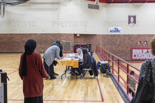 Hamtramck, Michigan USA, 27 February 2024, People check in to vote at Hamtramck High School in