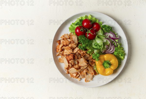 Gyros, chicken, with vegetables on plates, disassembled shawarma, fast food, appetizer, cooking