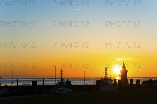 Pingelturm, historic lighthouse in the harbour, atmospheric, golden, beautiful sunset, silhouette