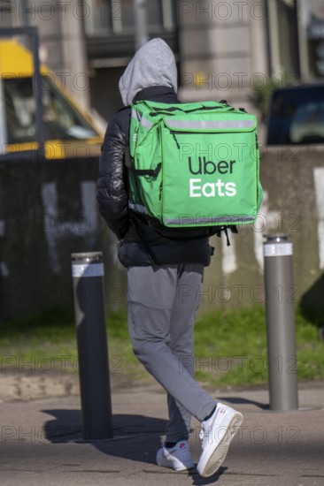 Food, food delivery service Uber Eats, delivery driver, on foot in Antwerp, Flanders, Belgium,