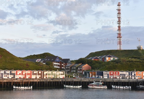 Lobster shacks and fishing boats in the harbour of Heligoland, Schleswig-Holstein, Germany, Europe