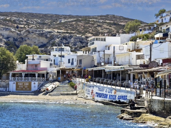 View of part of former fishing village Matala on south coast of Crete island in front of small