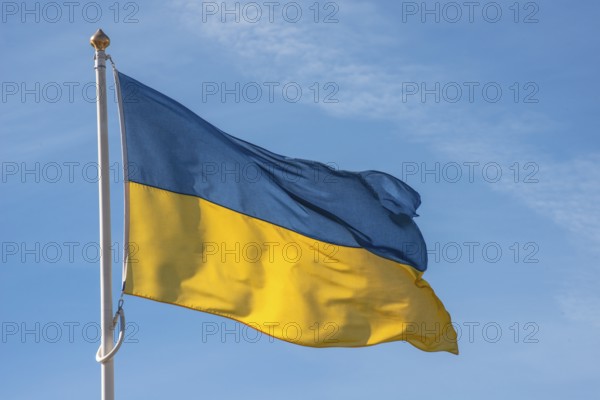 Ukrainian flag blowin in the wind at the harbor of Ystad, Scania, Sweden, Scandinavia, Europe