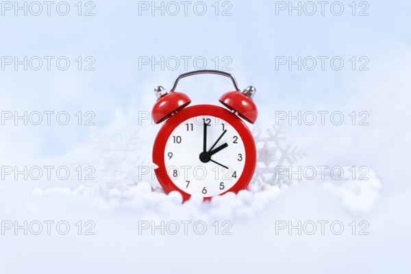 Winter time change for daylight saving in Europe on October 31st concept with red alarm clock