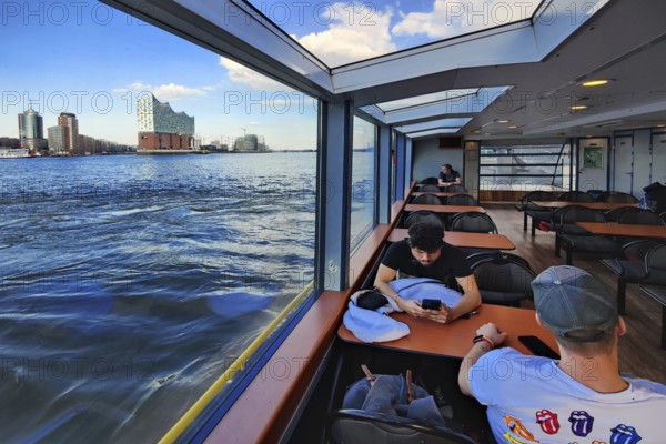 Harbour ferry on the Norderelbe with view of the Elbe Philharmonic Hall, Hamburg, Germany, Europe