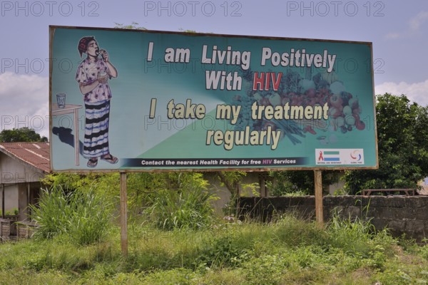 Sign with the inscription "I am living positively with HIV", near Koidu, Kono District, Eastern