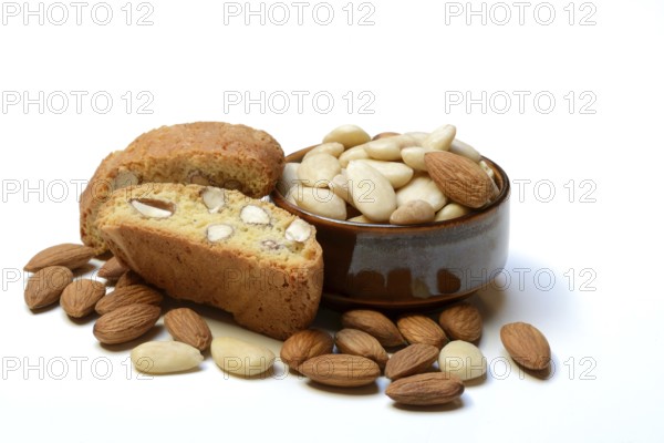 Cantucci and almonds in small bowls (Prunus dulcis)