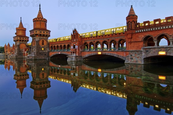 Oberbaum Bridge over the Spree with yellow underground in the early morning,