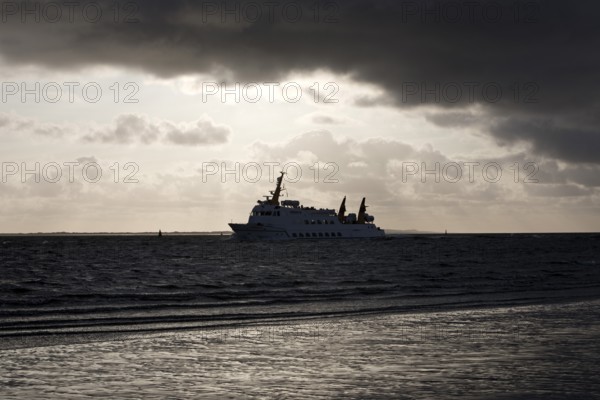 Seafaring vessel Frisia XI of the Norden-Frisia shipping company in bad weather off the East