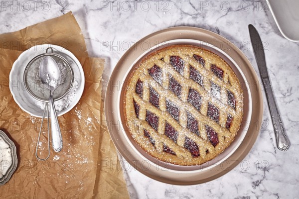 Top view of pie called 'Linzer Torte', a traditional Austrian shortcake pastry topped with fruit
