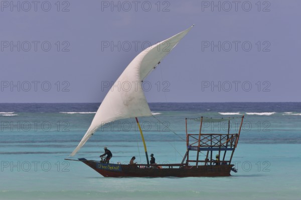 Dhow sailing on turquoise waters, Dongwe, Zanzibar, Tanzania, Africa