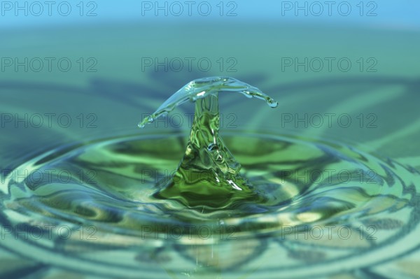 Water crystal, highspeed photography of drops of a water column hitting a water surface, studio