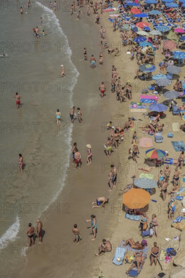 Tourists at the Playa Mal Pas, Benidorm, Province of Alicante, Costa Blanca, Spain, Europe